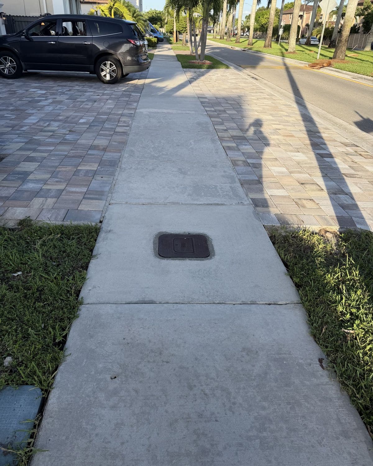 A finished sidewalk in late afternoon light, even from edge to edge